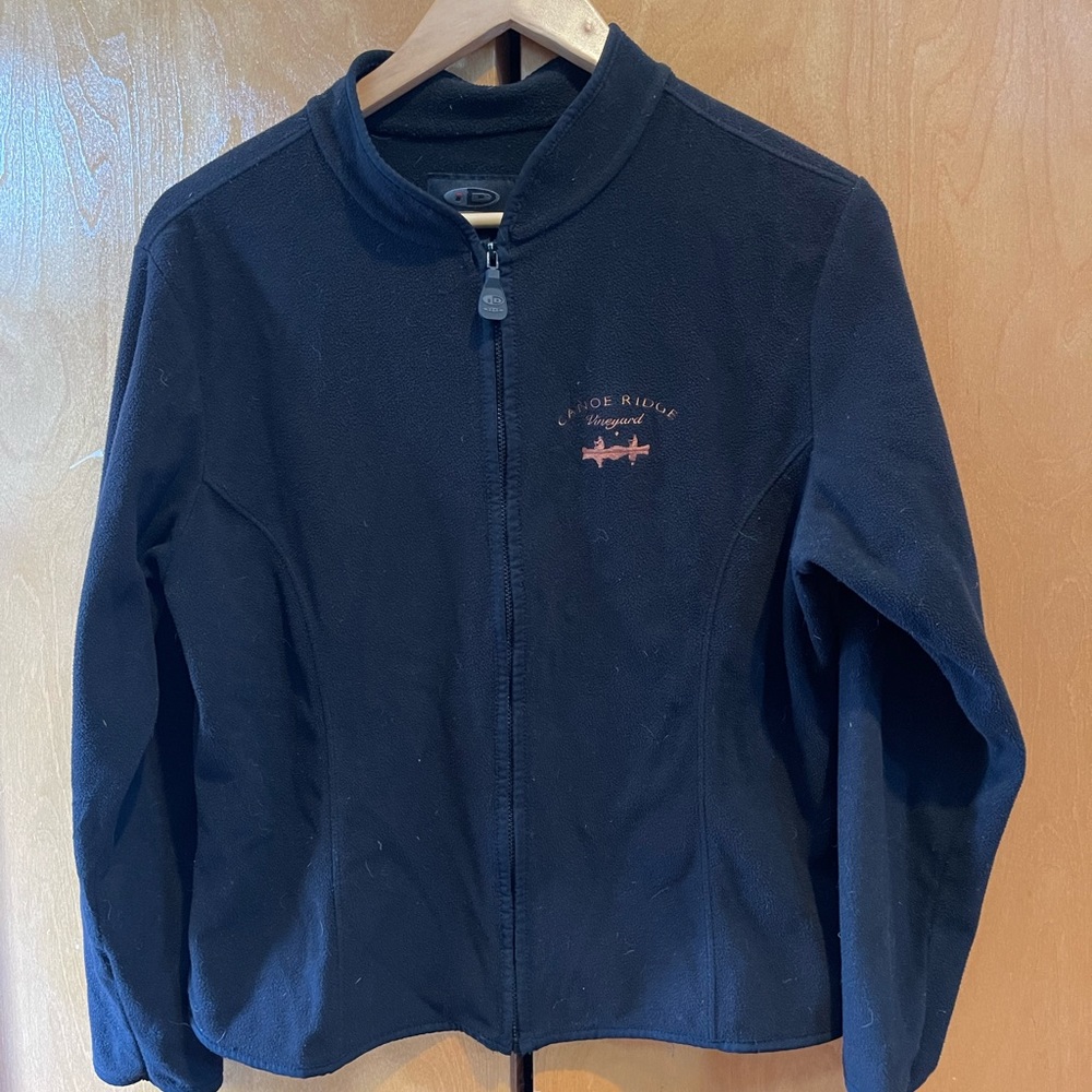 Lightweight fleece Canoe Ridge Vineyard logo zip up jacket.